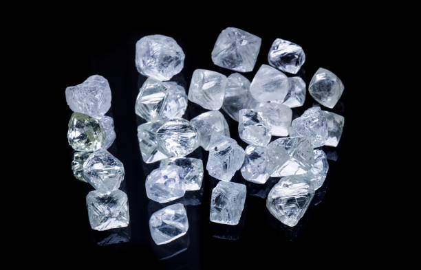 istock Raw diamonds isolated on black background. 950363960