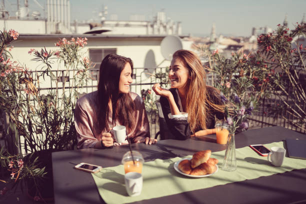 Women at the terrace drinking coffee and talking