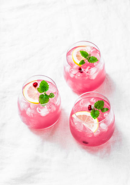 istock Pomegranate tequila cocktail. Summer light alcoholic drink,  cooling aperitif. On light background, top view, free space. Flat lay 950367640