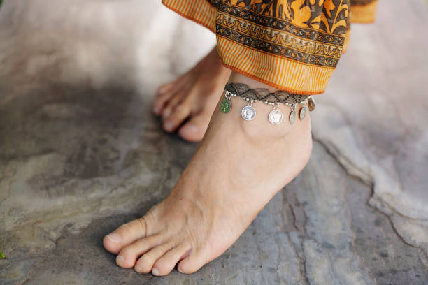 istock Female ankle with bracelet 950367800
