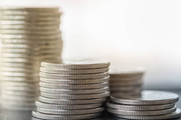istock Money and saving concept. Close up of three stack of silver coins. 950368170
