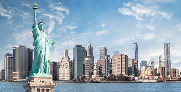 The statue of Liberty, Landmarks of New York City The statue of Liberty, Landmarks of New York City with Manhattan skyscraper background skyscraper photos stock pictures, royalty-free photos & images