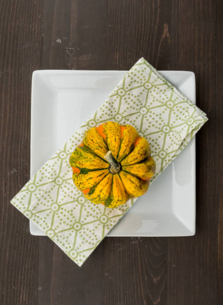istock Acorn Squash on Napkin and Square Plate 950372918