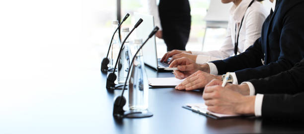 Speakers at business meeting