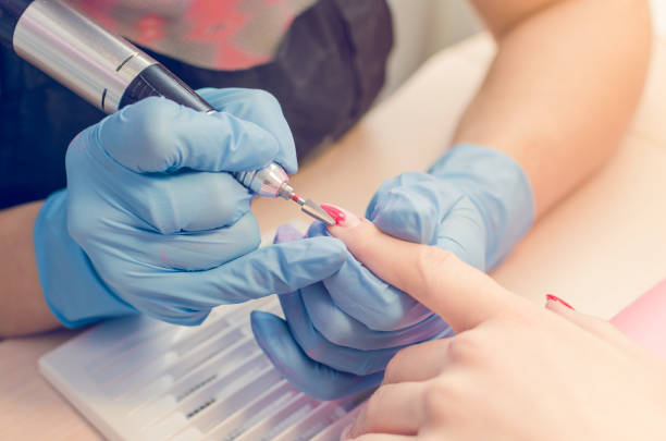 istock Manicure process, cleaning of nails by a milling cutter 950377398