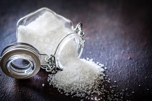 Coarse grained sea salt in a glass container
