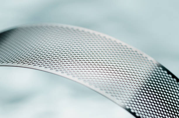 istock Metal perforated tape, abstract 950387722