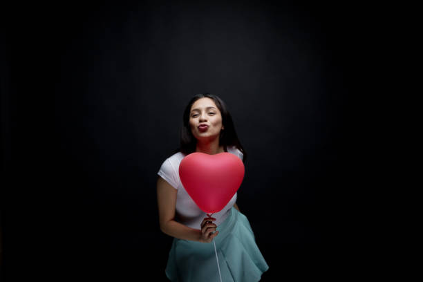 Pink heart symbol on a white background