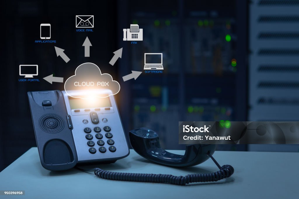 IP Telephony cloud pbx concept, telephone device with illustration icon of voip services IP Telephony cloud pbx concept, telephone device with illustration icon of voip services and networking data center on background Cloud Computing Stock Photo