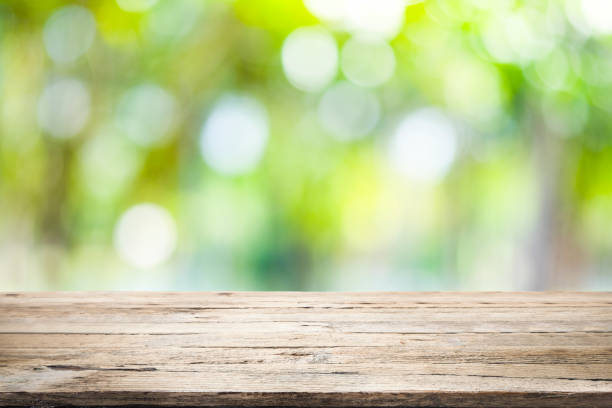 istock Wooden table with blur background of nature forest. 950404240