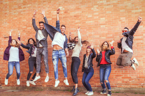 istock large group of friends jumping together 950404250