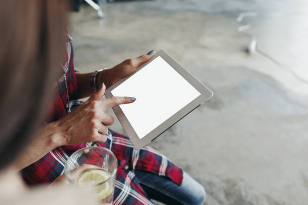 istock Woman hands holding digital tablet with blank screen 950409936