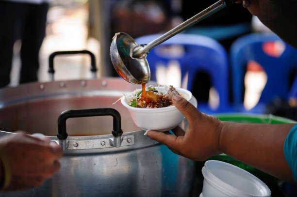 istock poverty concept feeding food for beggar 950410274