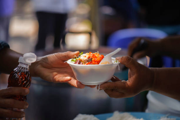 istock poverty concept feeding food for beggar 950410302