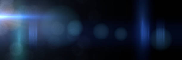 intense blue and mainly off screen lens flare overlay texture with bokeh effect with black background panorama banner