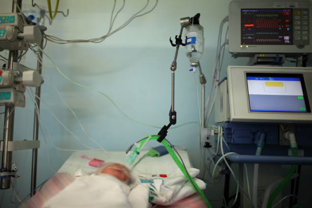 istock Child in the NICU connected to the life support device 950411658