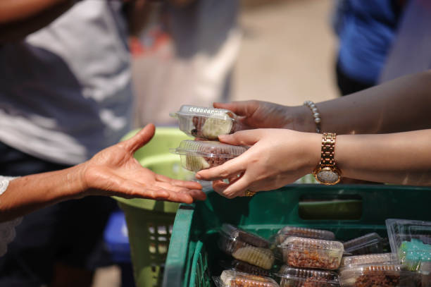 istock poverty concept feeding food for beggar 950412710