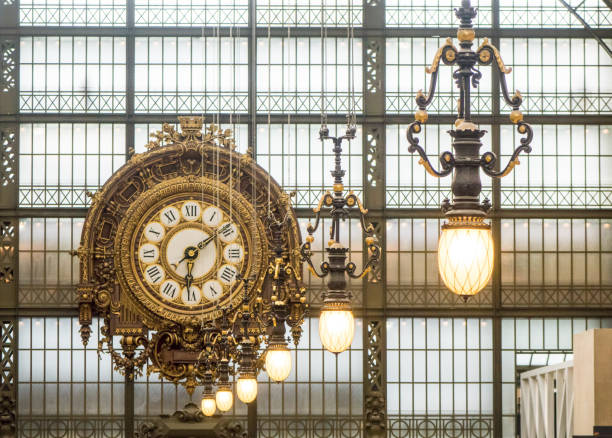 Orsay Museum (Musee d'Orsay) clock. Paris, France Paris, France - June 11 05, 2015: Golden clock in the Orsay Museum. The Musee d'Orsay is a museum in Paris, on the left bank of the river Seine. Musee d'Orsay has the largest collection of impressionist and post-impressionist paintings in the world. musee dorsay stock pictures, royalty-free photos & images