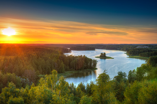 Sun sets over beautiful Jedzelewo Lake. Stare Juchy, Poland.