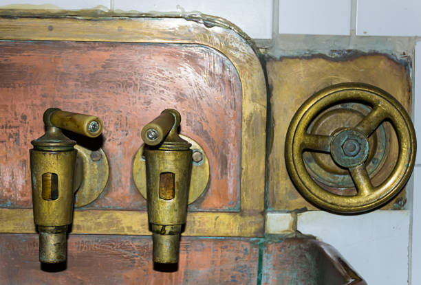 istock two copper tap wide with a valve close-up of an old dispensing system 950425476