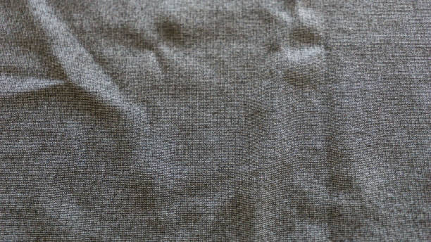 istock Macro from textile jersey made from black and grey cotton 950425636