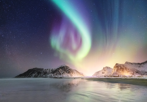 Northen light on the arctic beach. Beautiful natural landscape in the Norway