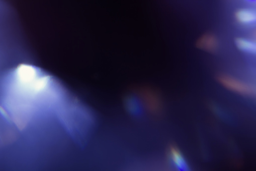 lens flare. colorful abstract blur bokeh light. dark background