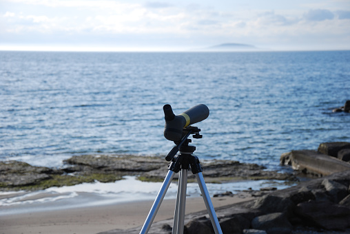 Birdwatching gear by the coast of the swedish island Oland in the Baltic Sea