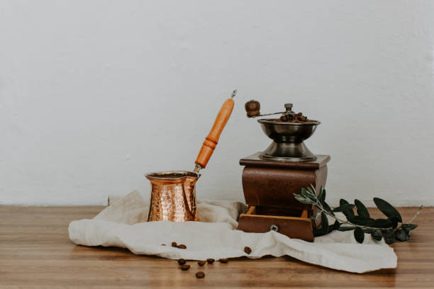 istock Turkish coffee pot and mill on linen napkin. Rural rustic background 950434038