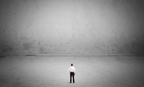 istock Small business person in large empty space 950436838