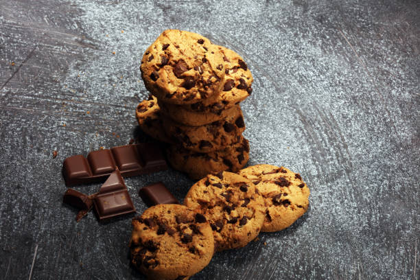istock Chocolate cookies on rustic table. Chocolate chip cookies 950437538