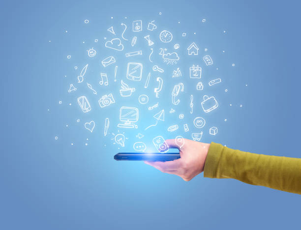 istock Hand with phone and drawn office icons 950438520