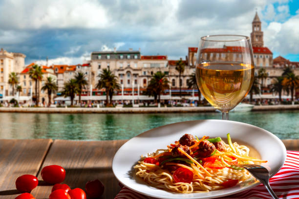Pasta with a plate of sauce on the table in Croatia, Split.