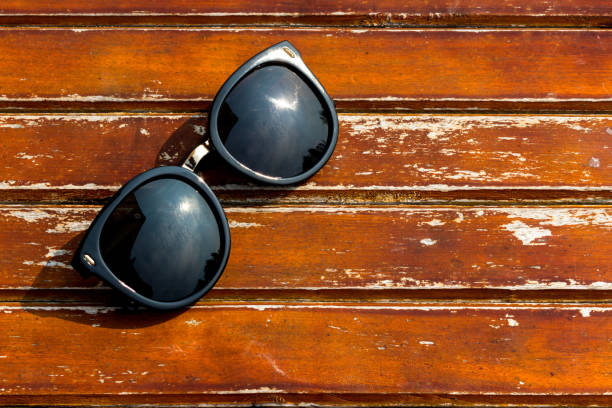 istock Sun glasses on the wooden table 950441776