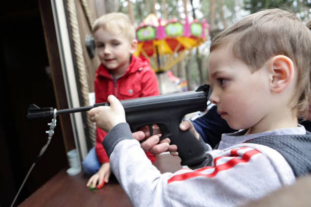 istock Kid shooting air pistol 950441872