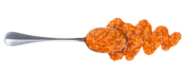 istock Sweet bavarian mustard with spoon isolated on white background. Top view 950447068