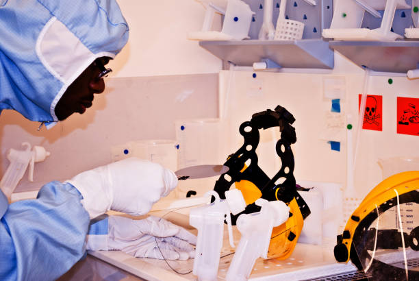 istock R&D: Researcher Performing Etching On Silicon Semiconductor Detectors On A Wafer 950447592