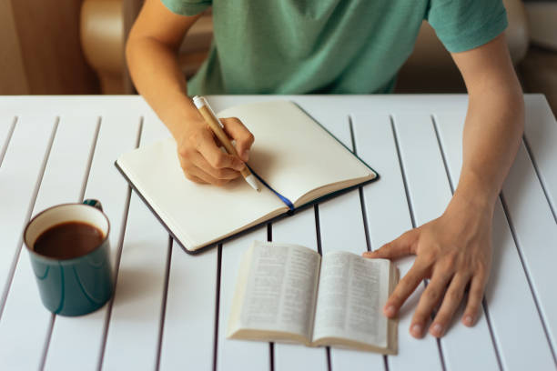 istock Teenage boy studying at desk 950447686