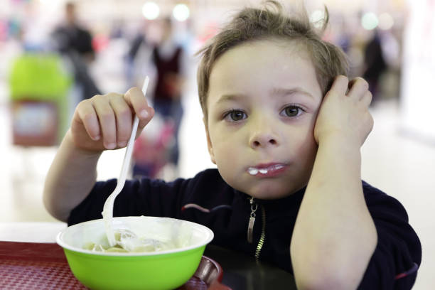 istock Pensive kid eating meat dumplings 950450718