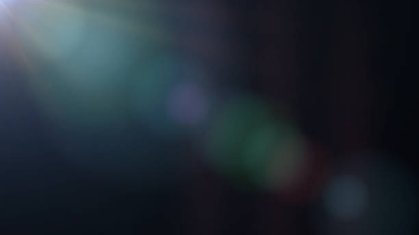 istock intense blue and mainly off screen lens flare overlay texture with bokeh effect with black background 950451696