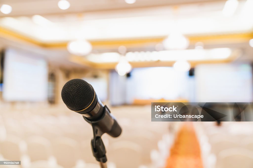 Microphone stand in conference hall. Public announcement event, Organization company meeting, or graduation award ceremony concept Microphone Stock Photo