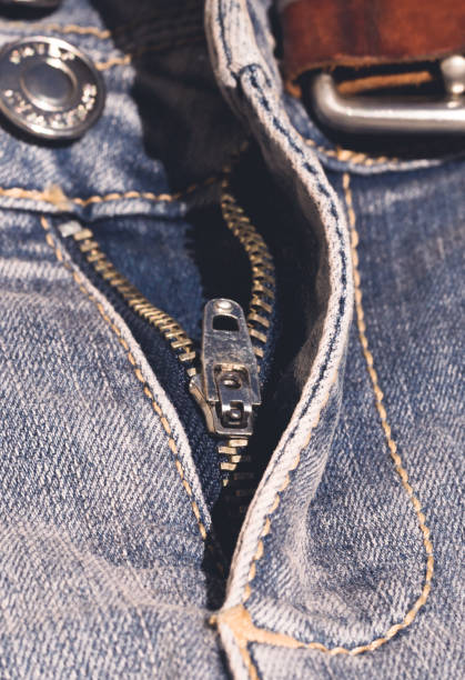istock Metal zipper on blue jeans 950457230