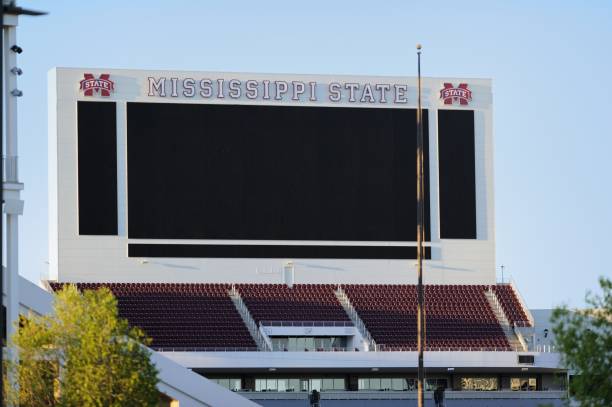 North end zone video screen score board at Mississippi State University Mississippi State University, Mississippi, USA - April 16, 2018: Large video screen scoreboard on the north end of Davis Wade Stadium at Mississippi State University. mississippi state university stock pictures, royalty-free photos & images