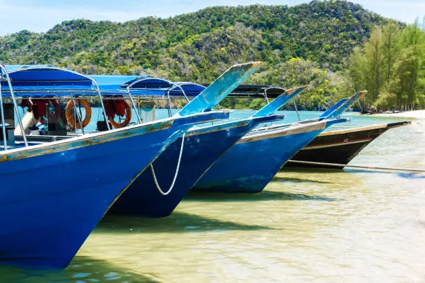 Wooden malaysian boats on the beach on tropical island, Langkawi island, Malaysia