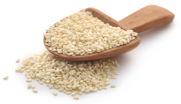 Peeled sesame seeds Peeled sesame seeds over white background sesame seed stock pictures, royalty-free photos & images