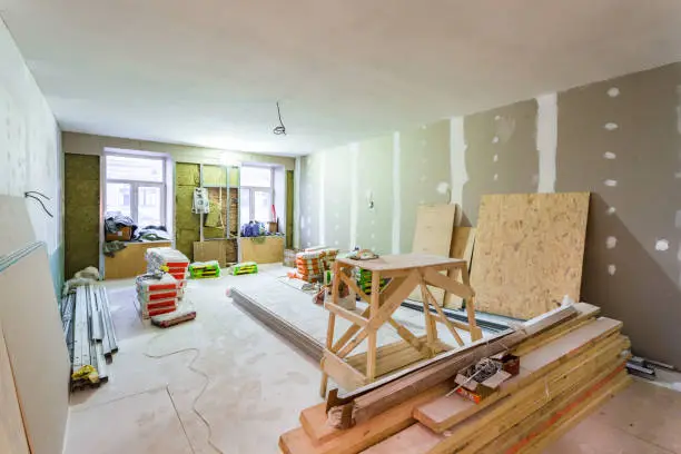 Working process of installing metal frames for plasterboard -drywall- for making gypsum walls  in apartment is under construction, remodeling, renovation, extension, restoration, upgrading and reconstruction.