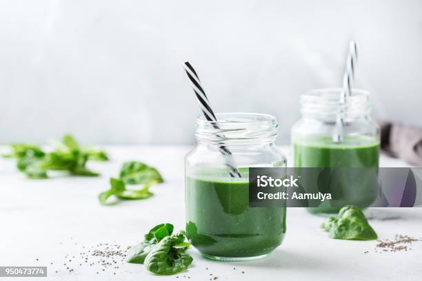 Healthy Green Vegan Smoothie With Spinach Spirulina And Chia Seeds Stock Photo - Download Image Now