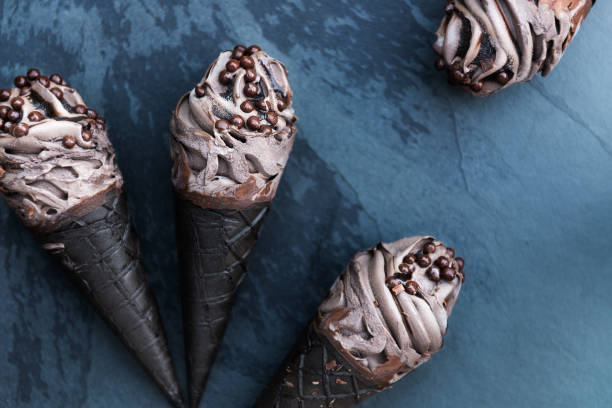 istock Double Chocolate Ice Creams with Black Waffle Cones 950473952