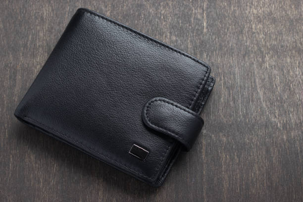 istock black leather wallet on a wooden background 950474290