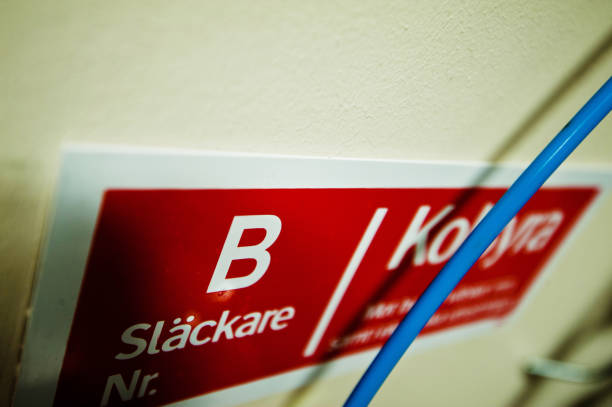 istock Warning or Hazard Sign / Label: Highly Corrosive Chemical Caution Sign On Storage Cabinet 950482298
